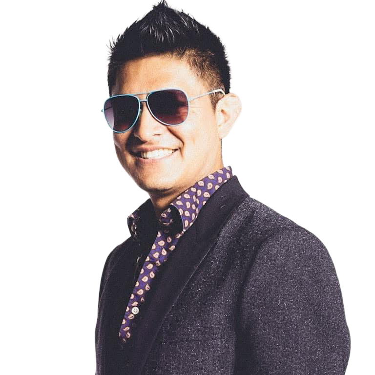 Dance in the Dark™: Groove to Give Festival Jose Pepe Hernandez, Groove to Give Festival instructor, smiling and wearing sunglasses, a dark jacket and patterned shirt.