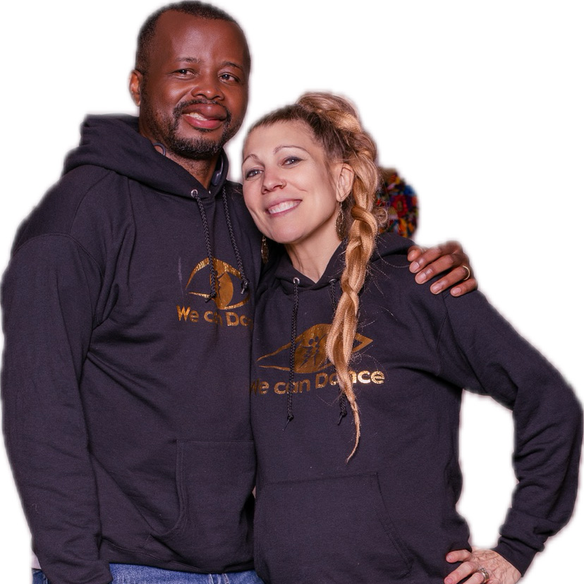 Dance in the Dark™: Groove to Give Festival Samy and Nikki Vez, Groove to Give Festival instructors, standing together wearing black We C