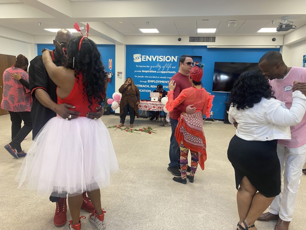 Several pairs practice partner dancing together during the Valentine’s event.